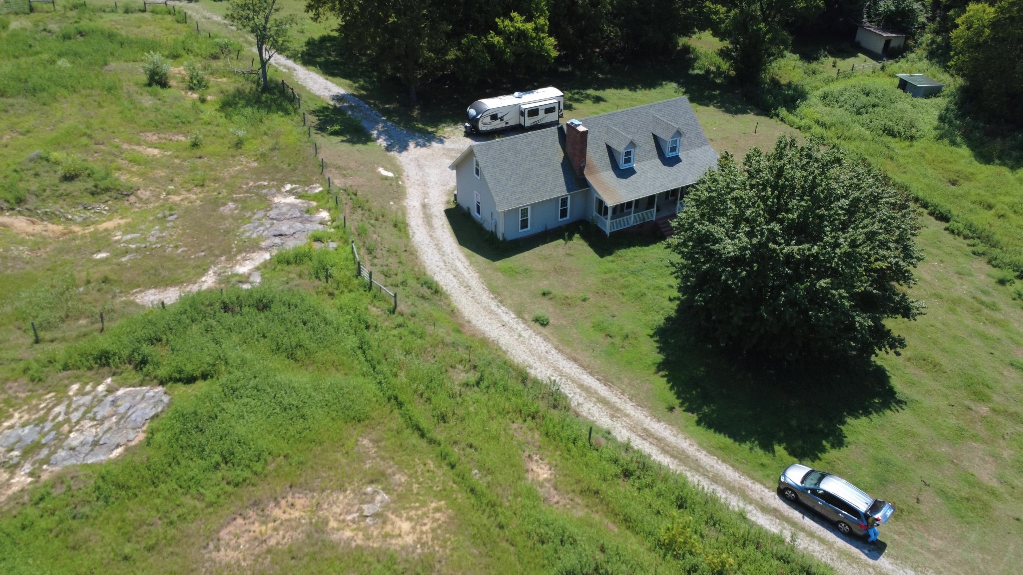 1450 Donna Road Lewisburg, TN 37091 - Photo 31 of 33 an aerial view of a house with a yard and trees all around