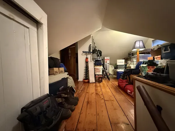 a hallway with a view of living room