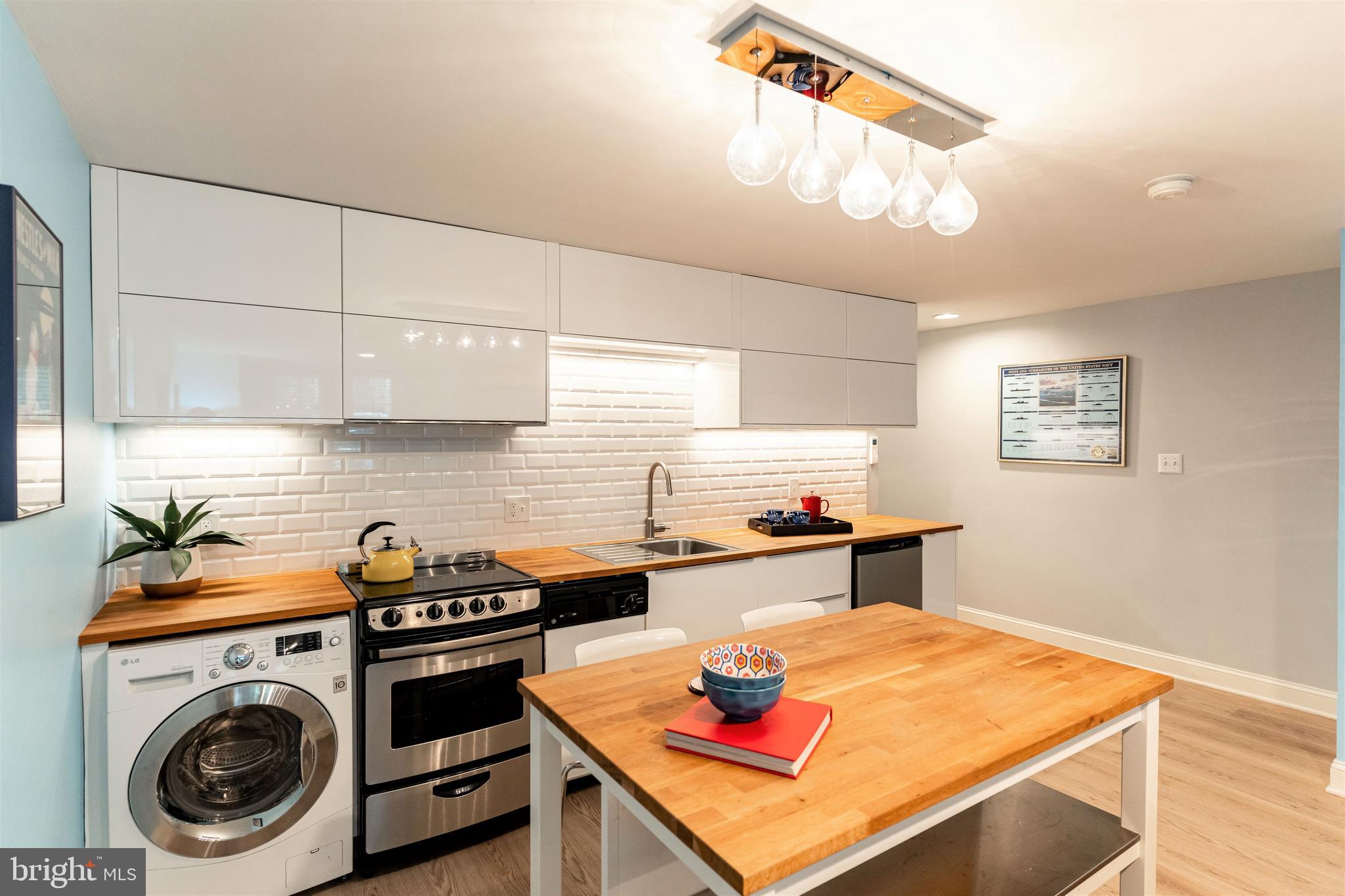 238 10th Street Northeast Washington, DC 20002 - Photo 23 of 29 Lower Level Kitchen with extra washer/dryer