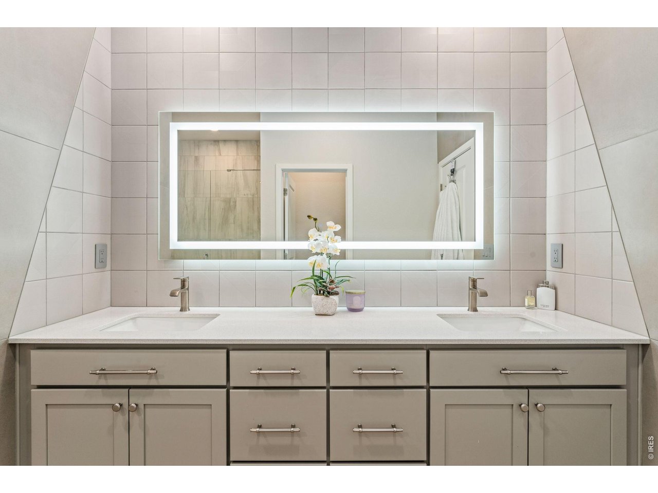 5018 Leopold Loop Timnath, CO 80547 - Photo 26 of 50 a bathroom with a sink vanity and mirror
