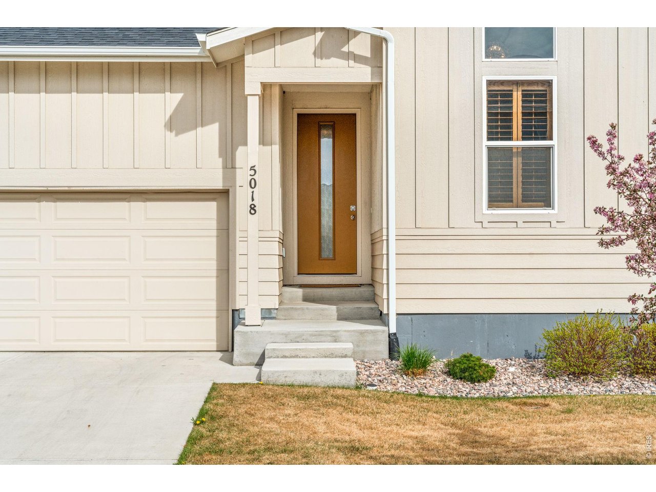 5018 Leopold Loop Timnath, CO 80547 - Photo 4 of 50 a front view of a house with a yard