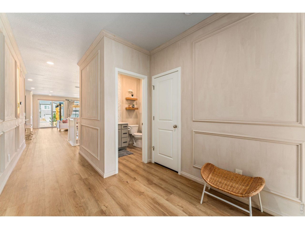 5018 Leopold Loop Timnath, CO 80547 - Photo 5 of 50 a view of a hallway with wooden floor and furniture