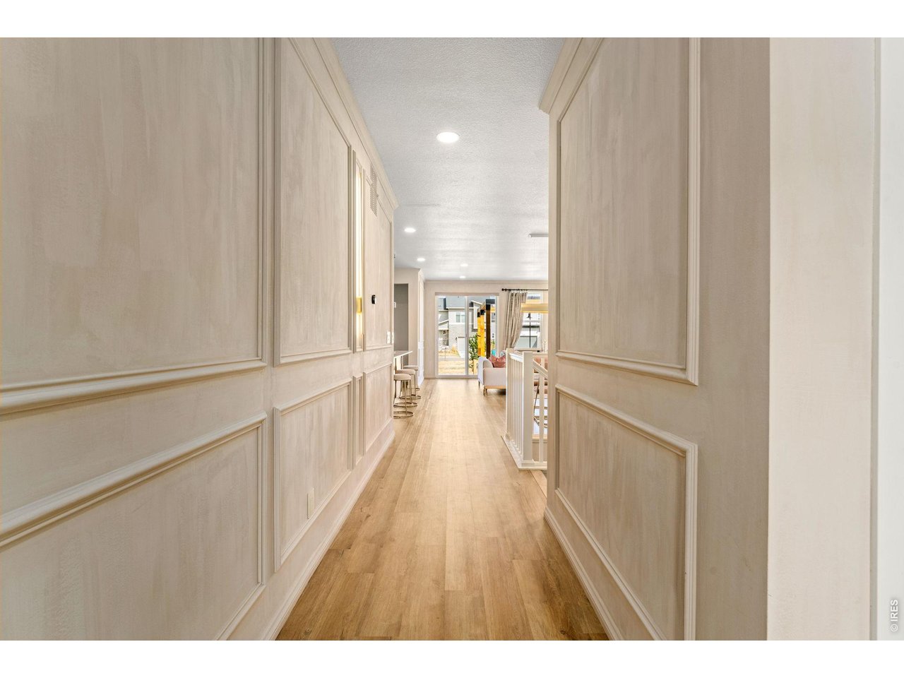 5018 Leopold Loop Timnath, CO 80547 - Photo 6 of 50 a view of a hallway with wooden floor