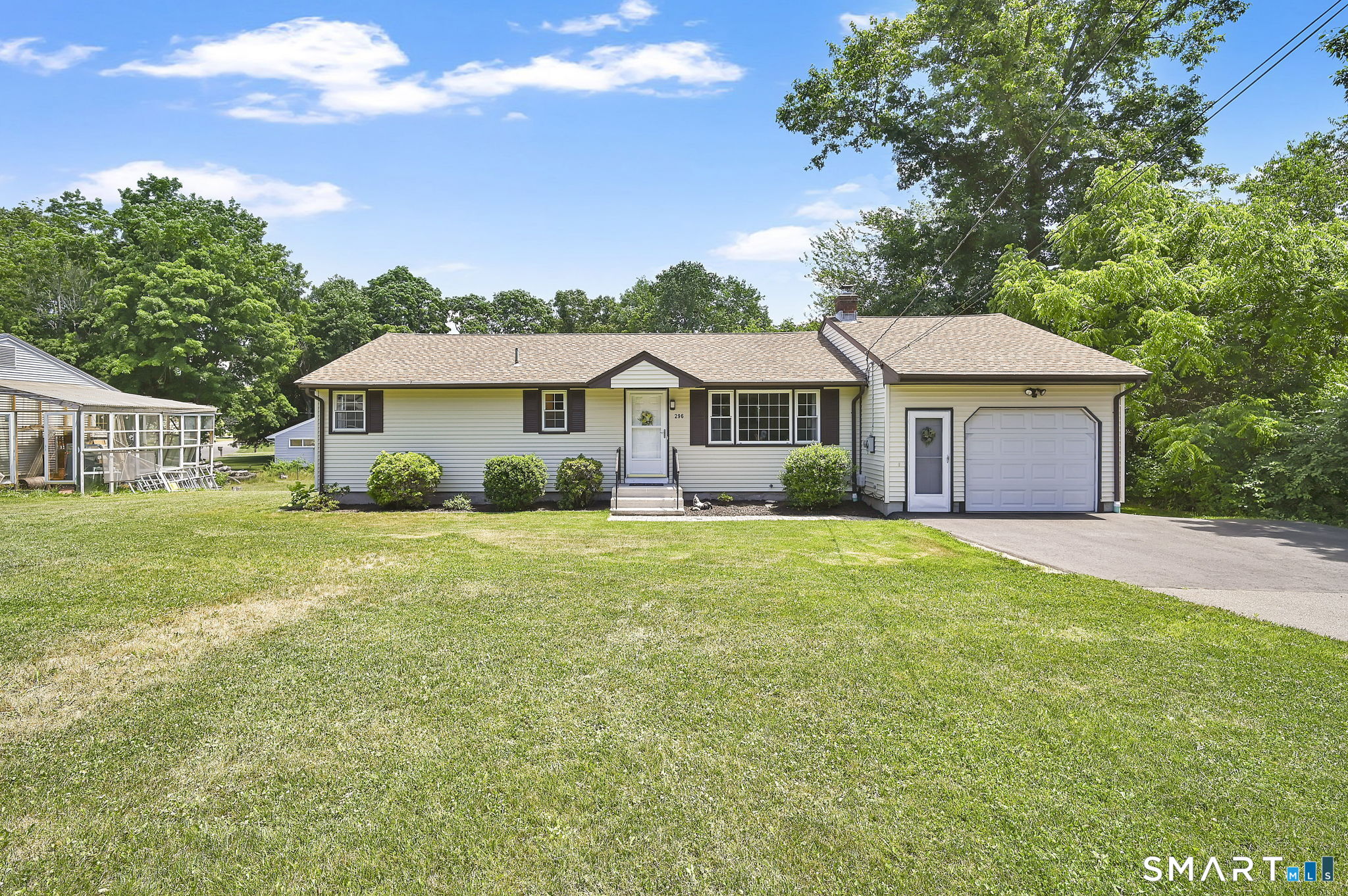296 Phoenix Street Vernon, CT 06066 - Photo 1 of 34 a front view of a house with a garden