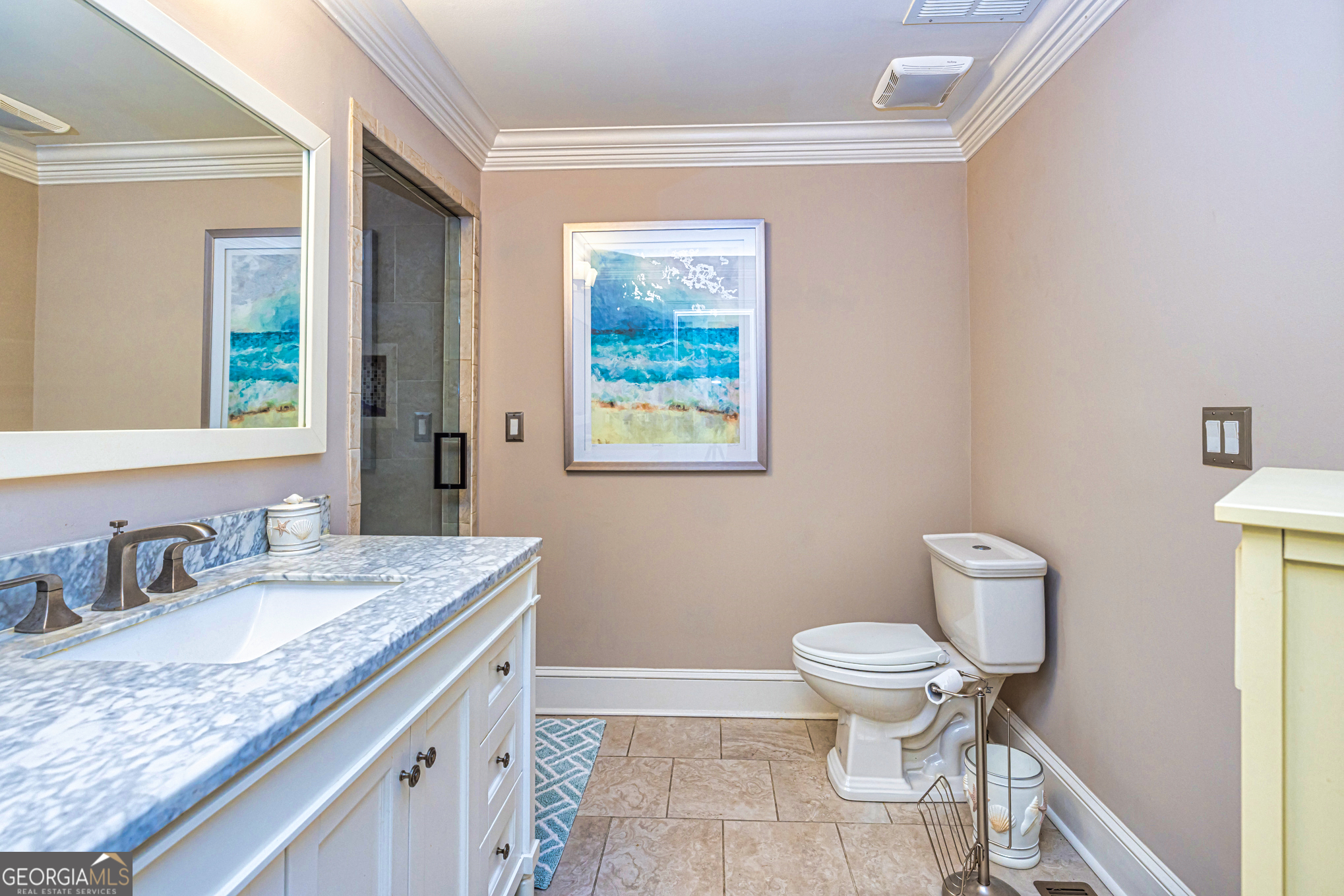 131 Lincoln Road Tyrone, GA 30290 - Photo 43 of 78 a bathroom with a granite countertop toilet a sink and a mirror