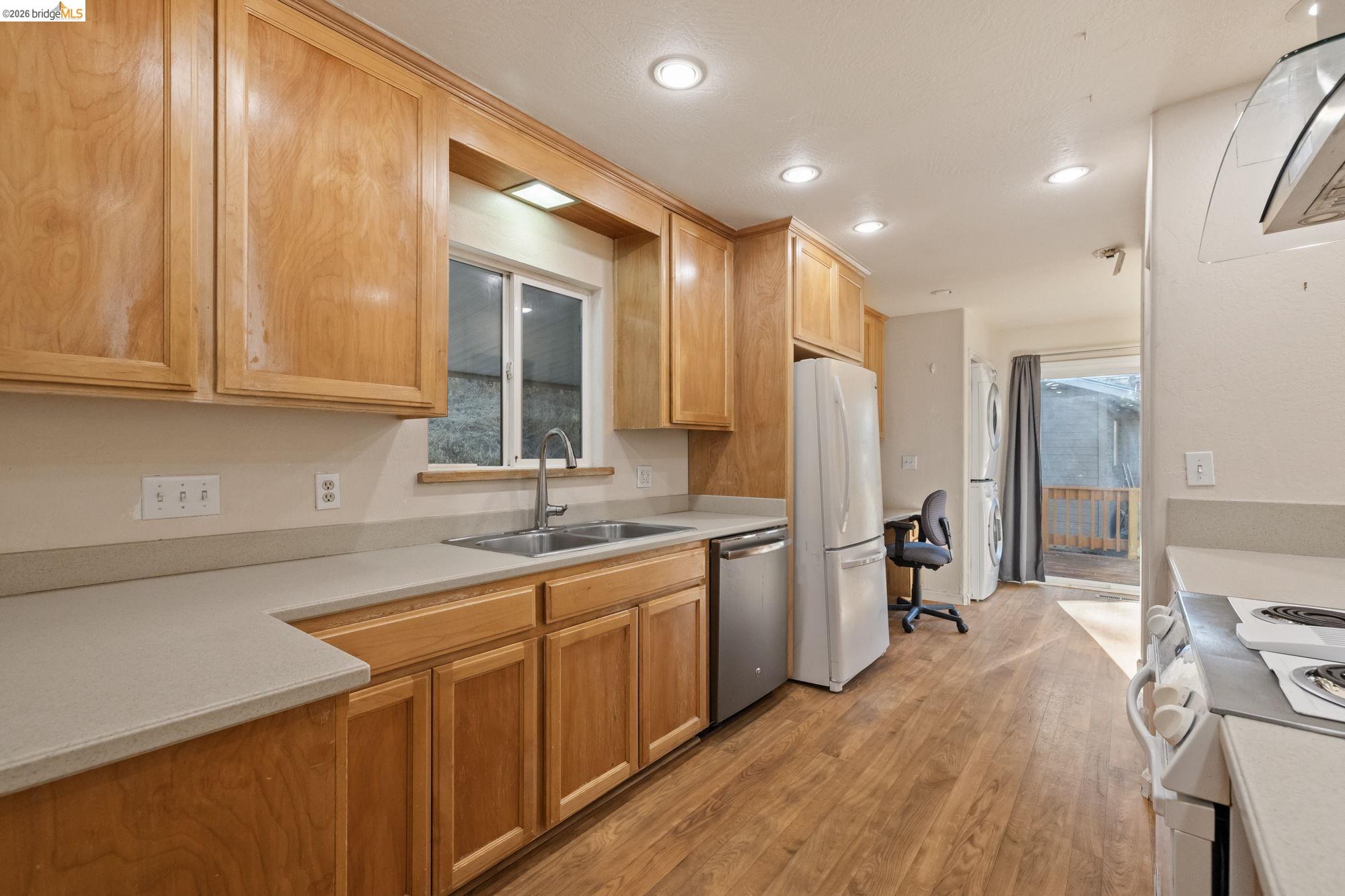 13904 Tuolumne Road Sonora, CA 95370 - Photo 12 of 31 a kitchen with stainless steel appliances granite countertop a sink stove and refrigerator