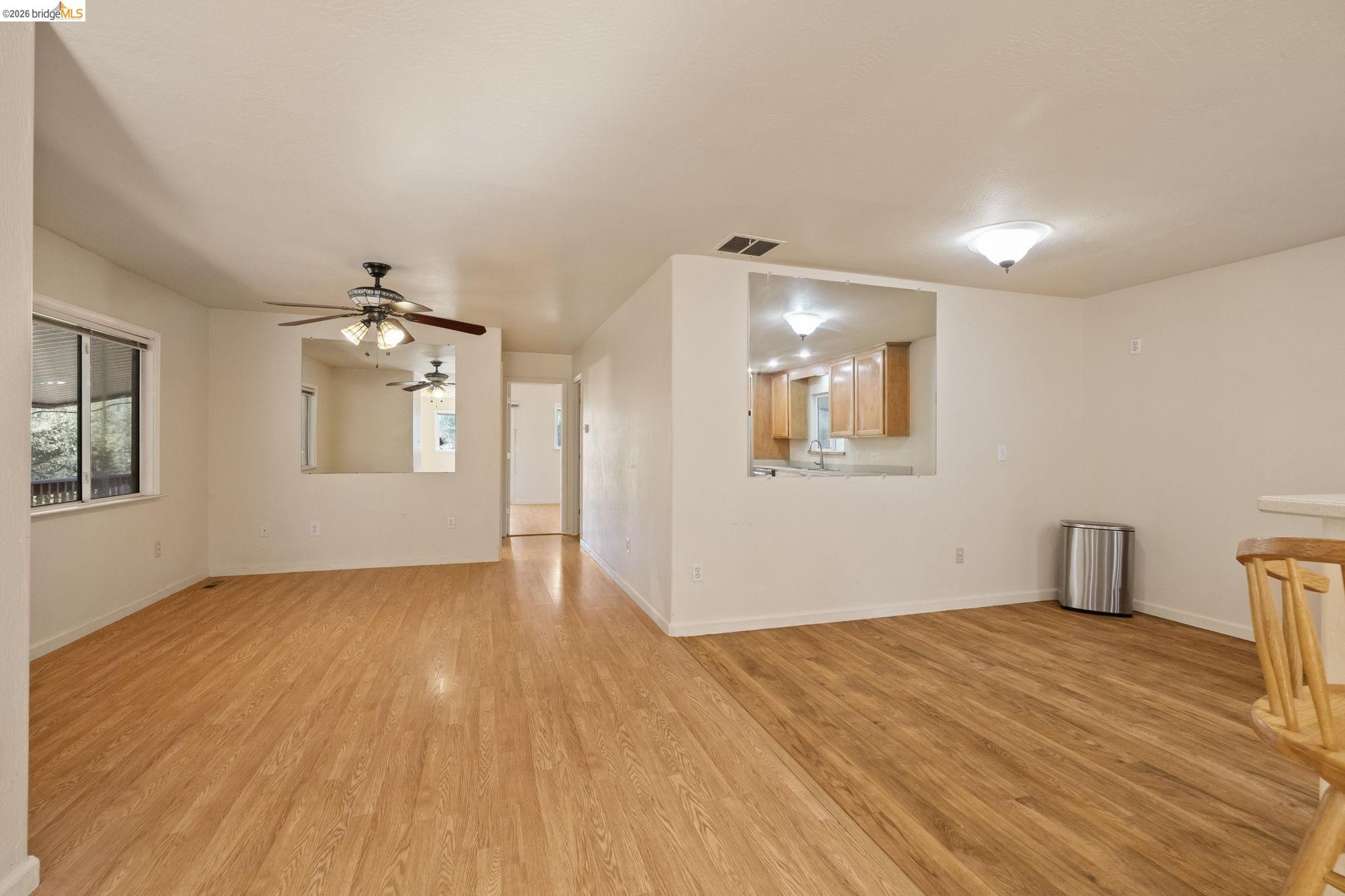 13904 Tuolumne Road Sonora, CA 95370 - Photo 14 of 31 a view of empty room with wooden floor and fan