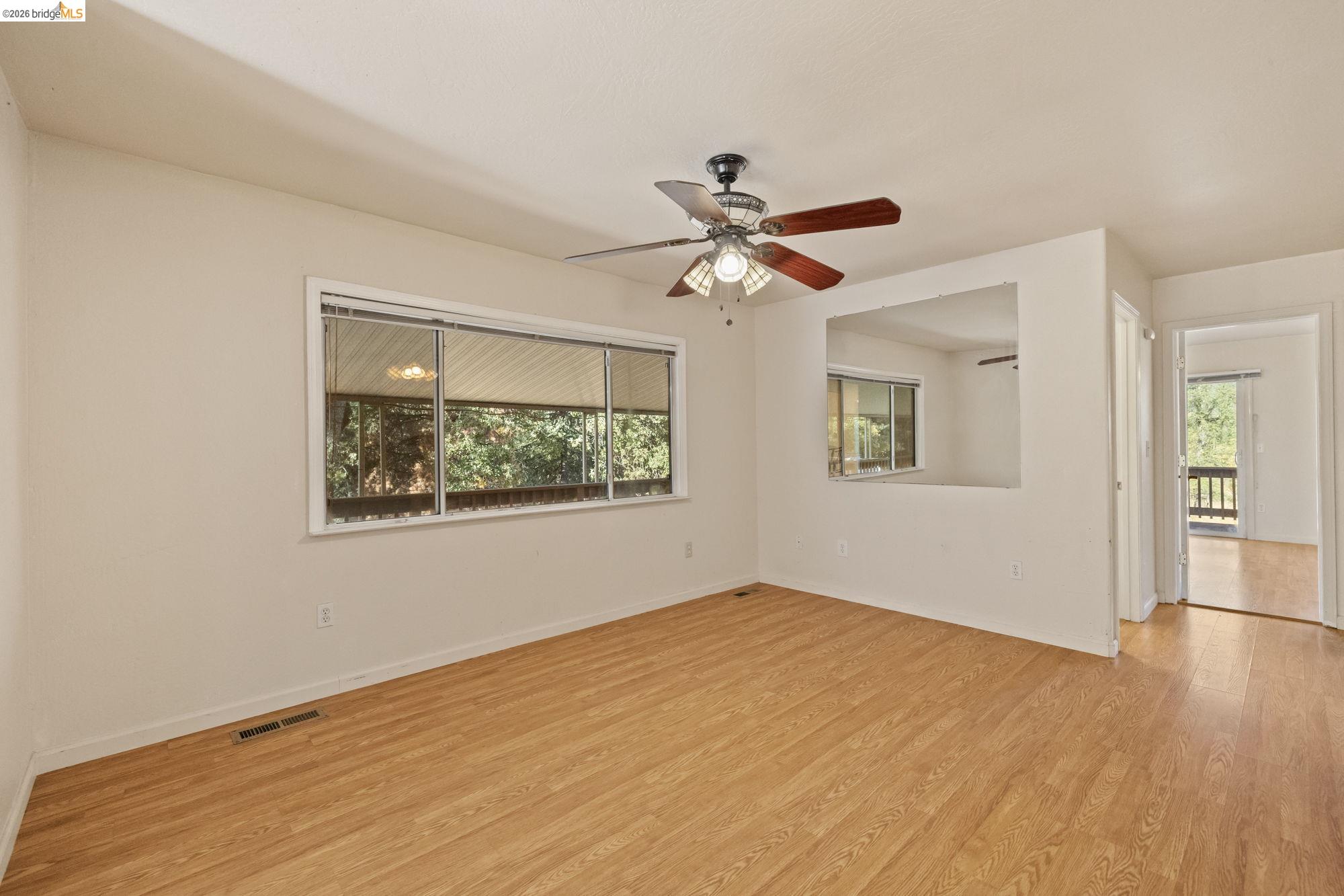 13904 Tuolumne Road Sonora, CA 95370 - Photo 16 of 31 a view of an empty room with a window