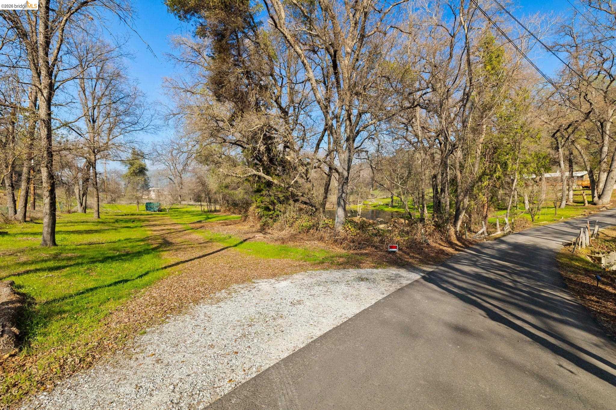13904 Tuolumne Road Sonora, CA 95370 - Photo 27 of 31 a view of a yard with trees