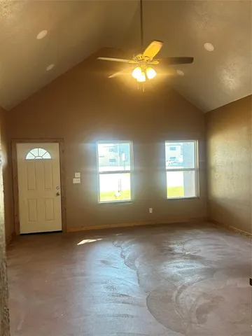 a view of wooden floor and windows in an empty room