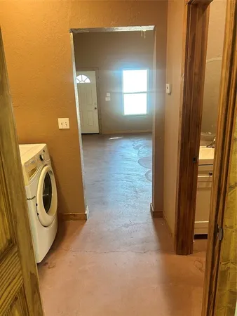 a view of a storage & utility room with a washer dryer