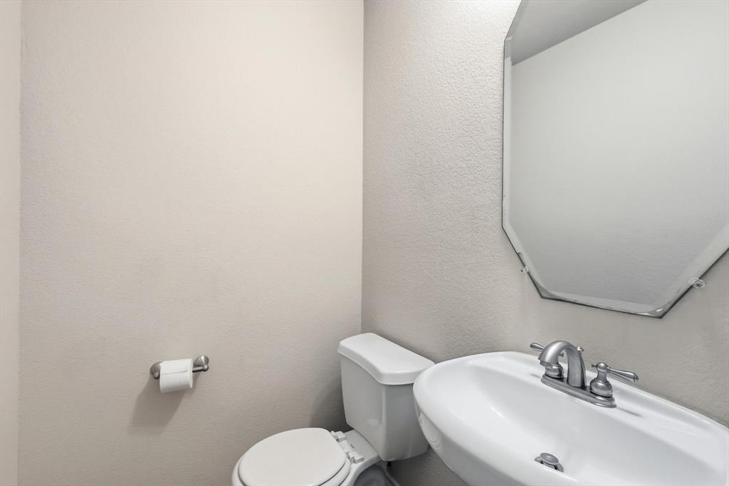 5038 West Fall Drive Midlothian, TX 76065 - Photo 15 of 40 Bathroom featuring toilet and a textured wall