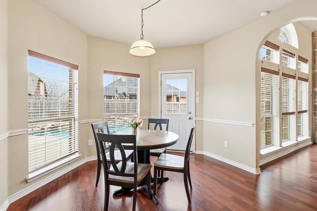 5038 West Fall Drive Midlothian, TX 76065 - Photo 20 of 40 Dining space with arched walkways and dark wood finished floors