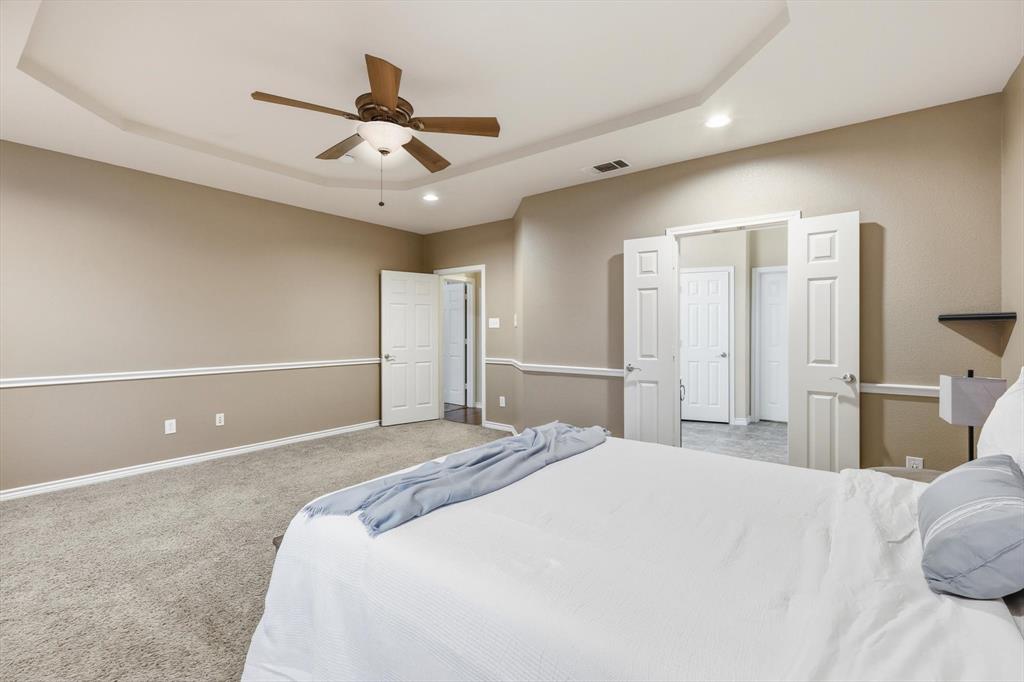 5038 West Fall Drive Midlothian, TX 76065 - Photo 21 of 40 Bedroom featuring carpet floors, a tray ceiling, recessed lighting, and ceiling fan