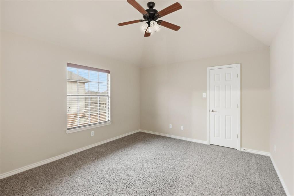 5038 West Fall Drive Midlothian, TX 76065 - Photo 28 of 40 Carpeted spare room featuring vaulted ceiling and ceiling fan