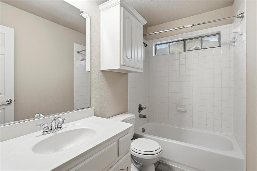 5038 West Fall Drive Midlothian, TX 76065 - Photo 30 of 40 Bathroom featuring vanity and shower / tub combination