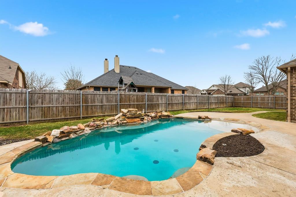 5038 West Fall Drive Midlothian, TX 76065 - Photo 36 of 40 View of swimming pool featuring a fenced backyard and patio surround