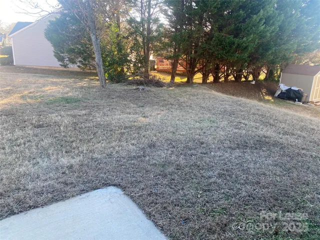 a view of a backyard of the house