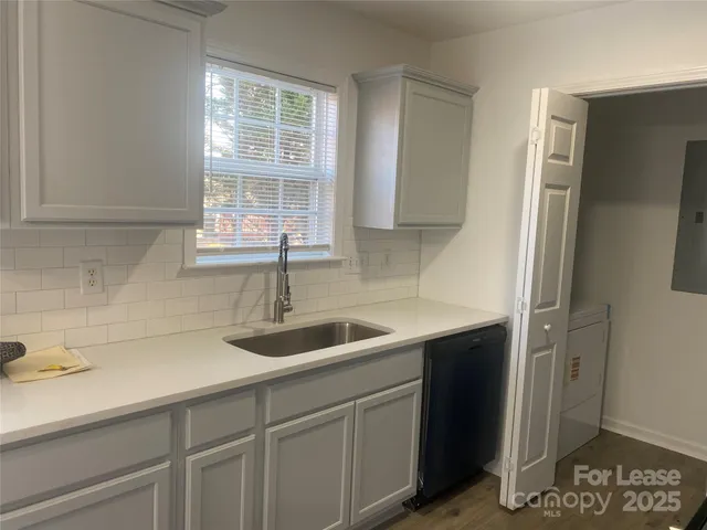 a kitchen with a sink and cabinets