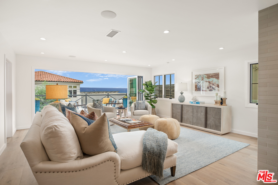 232 Waterview Street Playa del Rey, CA 90293 - Photo 8 of 51 a living room with furniture and a large window