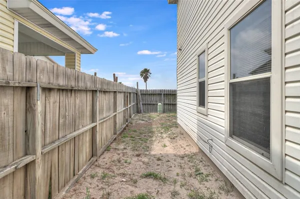 a view of a pathway of a house with wooden floor
