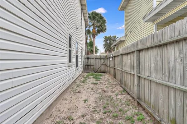 a view of a pathway with a backyard