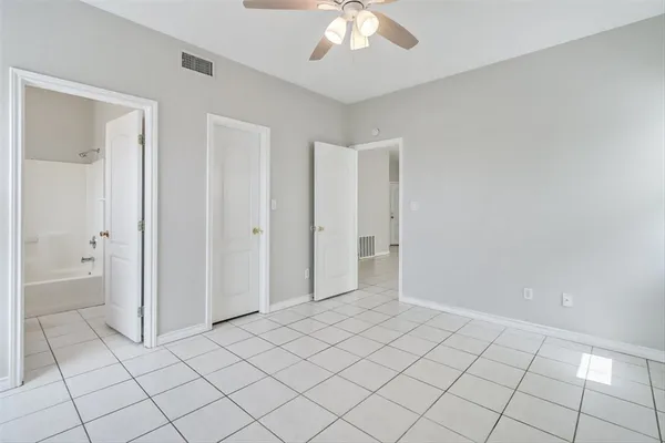 a bathroom with a tub and window