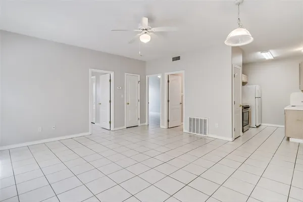 a view of a livingroom with a chandelier fan