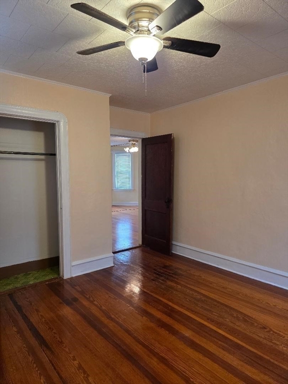 146 Middlesex Street, Unit 2 Fall River, MA 02723 - Photo 13 of 19 a view of an empty room with wooden floor and a ceiling fan
