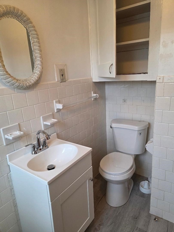 146 Middlesex Street, Unit 2 Fall River, MA 02723 - Photo 17 of 19 a bathroom with a toilet sink and mirror