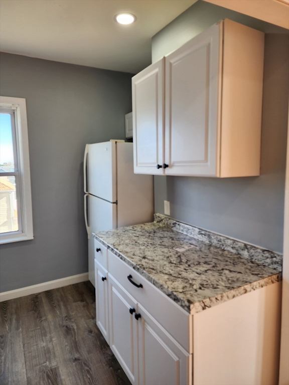 146 Middlesex Street, Unit 3 Fall River, MA 02723 - Photo 2 of 9 a kitchen with granite countertop cabinets and refrigerator