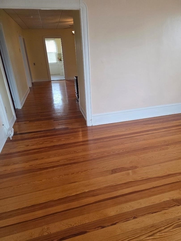 146 Middlesex Street, Unit 2 Fall River, MA 02723 - Photo 5 of 19 a view of a hallway with wooden floor and staircase