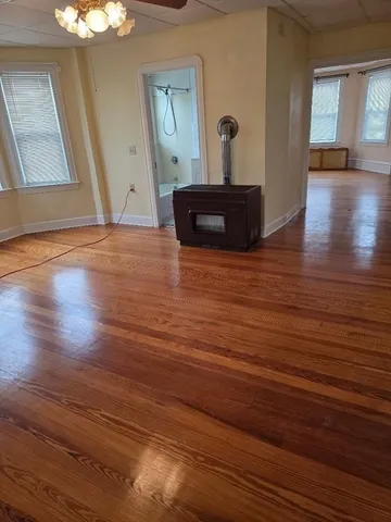 a view of a livingroom with wooden floor
