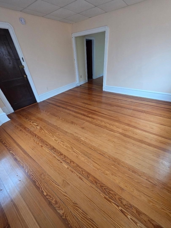 146 Middlesex Street, Unit 2 Fall River, MA 02723 - Photo 8 of 19 a view of empty room with wooden floor
