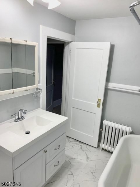 927 South Park Terrace, Unit 2 Union, NJ 07083 - Photo 7 of 12 a bathroom with a sink and a mirror