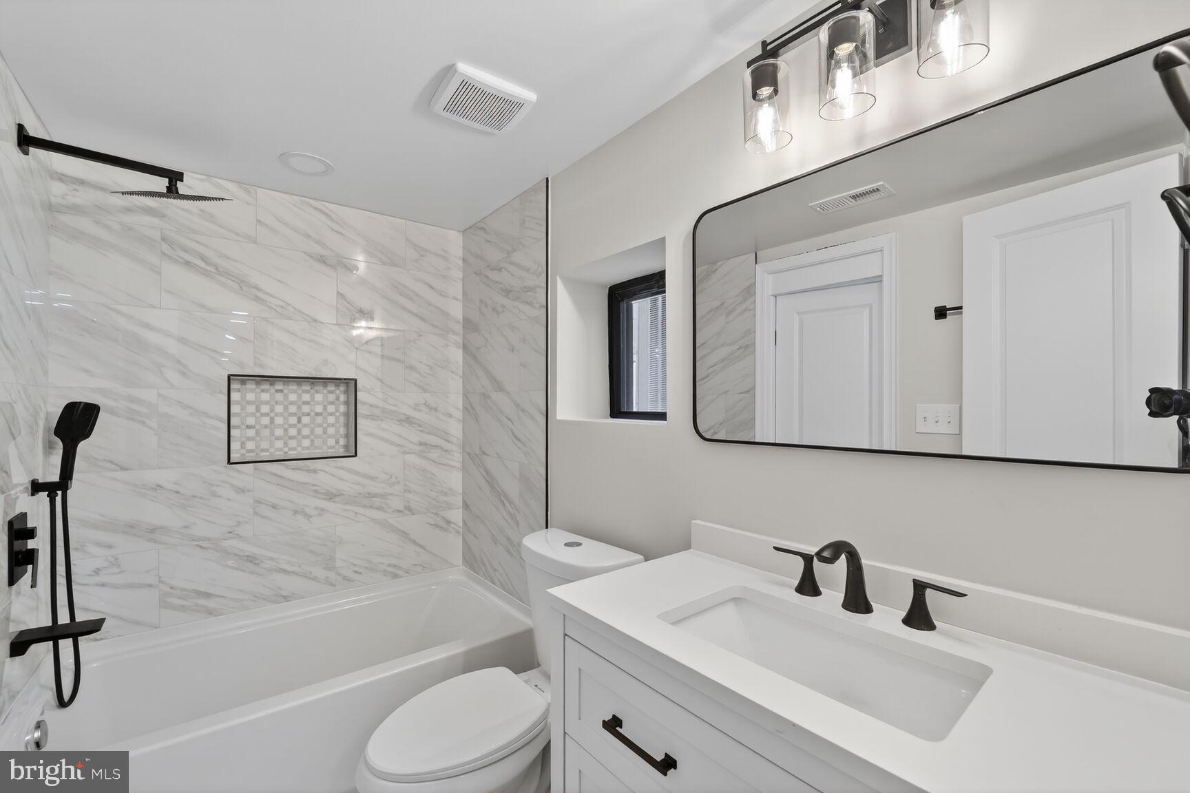4017 14th Street Northwest Washington, DC 20011 - Photo 17 of 25 a bathroom with a sink toilet and shower