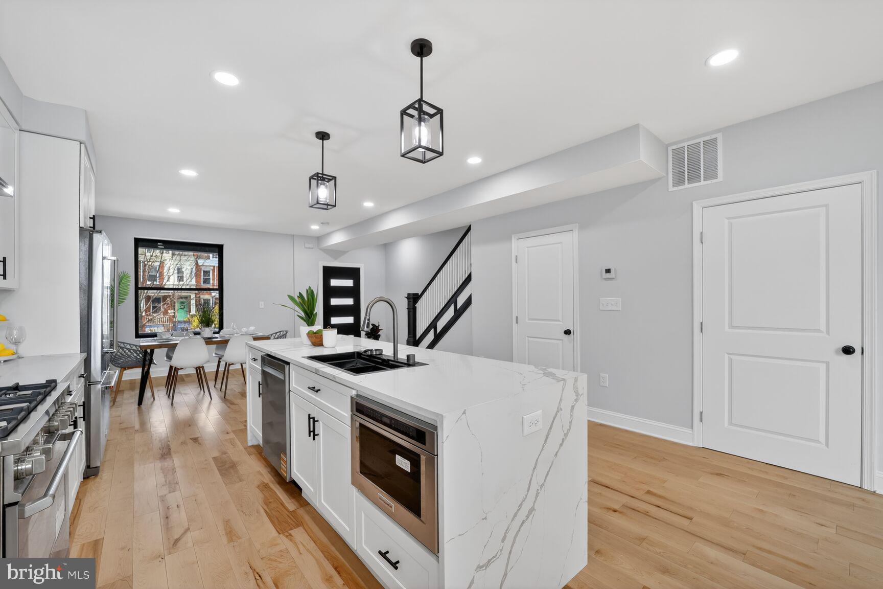 4017 14th Street Northwest Washington, DC 20011 - Photo 5 of 25 a open kitchen with a stove and cabinets