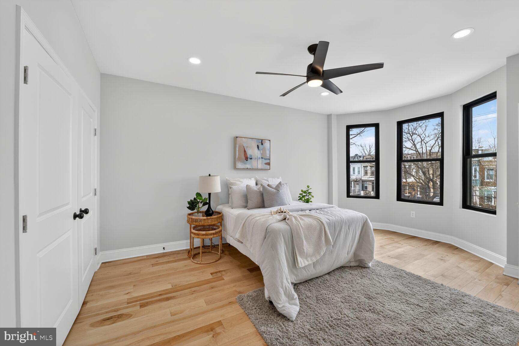 4017 14th Street Northwest Washington, DC 20011 - Photo 9 of 25 a spacious bedroom with a bed and a large window