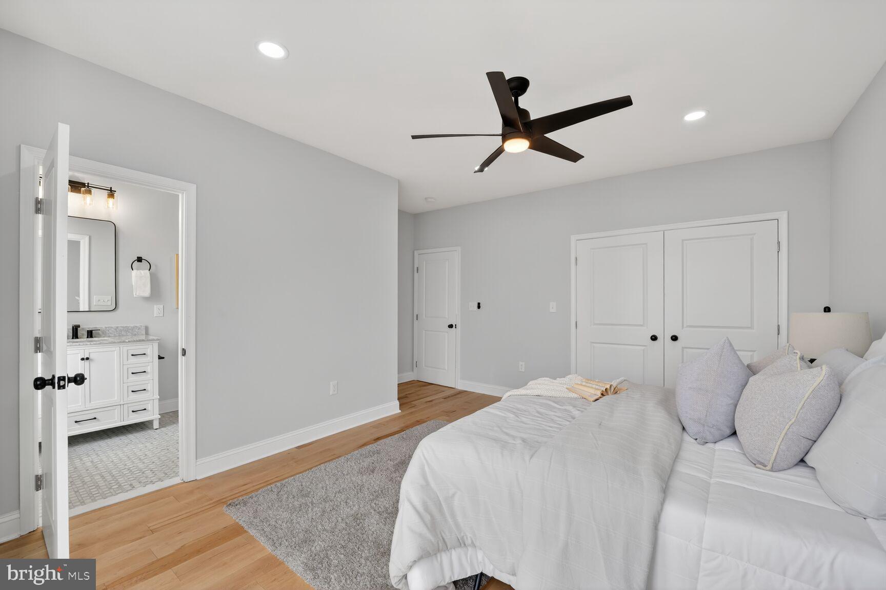 4017 14th Street Northwest Washington, DC 20011 - Photo 10 of 25 a bedroom with a large bed and wooden floor