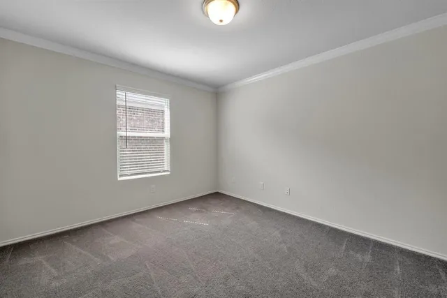 an empty room with window and windows