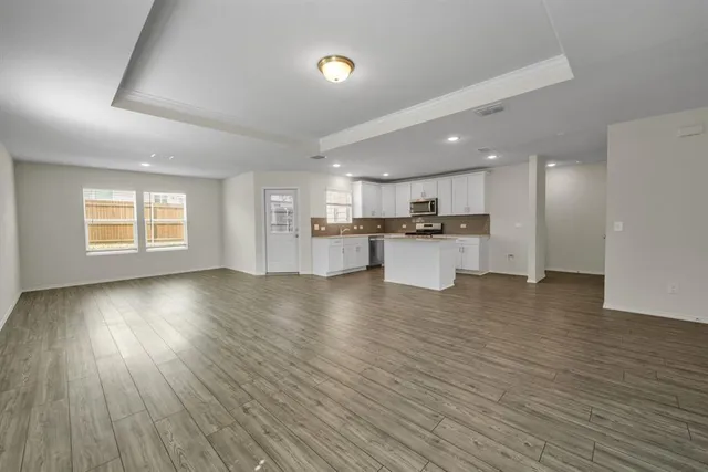 a view of a kitchen with a sink and a stove top oven