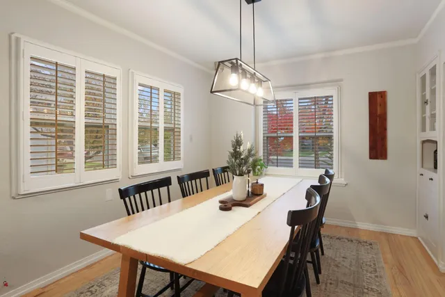a view of a dining room with furniture window and outside view
