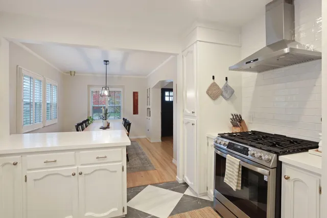 a kitchen with granite countertop cabinets and steel stainless steel appliances