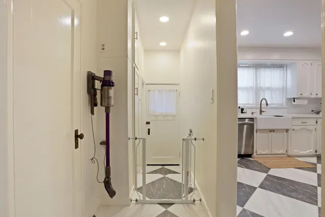 a bathroom with a double vanity sink a mirror and a shower
