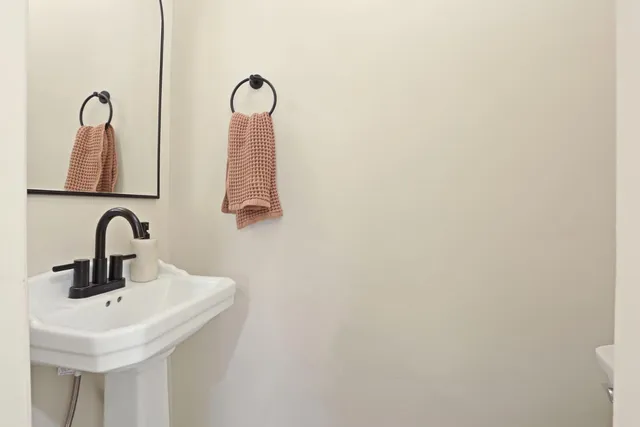 a bathroom with a sink and mirror