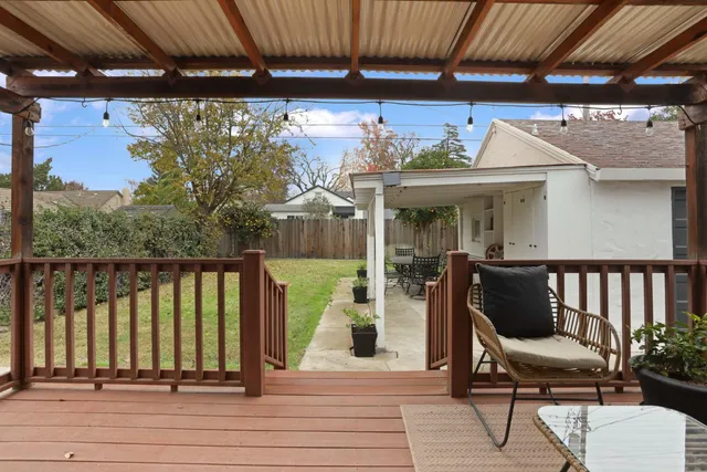 a view of a chairs and table in the balcony