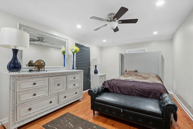 a bedroom with a bed and a dresser