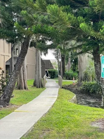 a view of house with swimming pool yard and outdoor seating