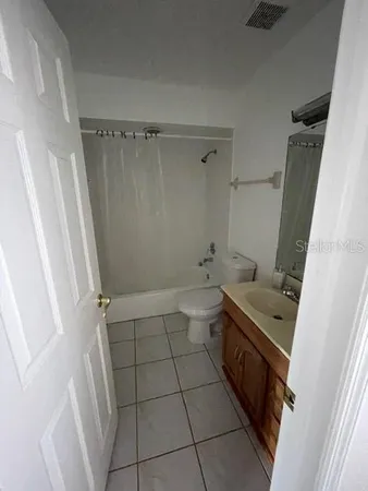 a bathroom with a bathtub sink and toilet