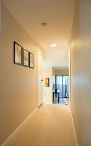 417 Kenbrook Circle San Jose, CA 95111 - Photo 14 of 22 a view of empty room with wooden floor and fireplace